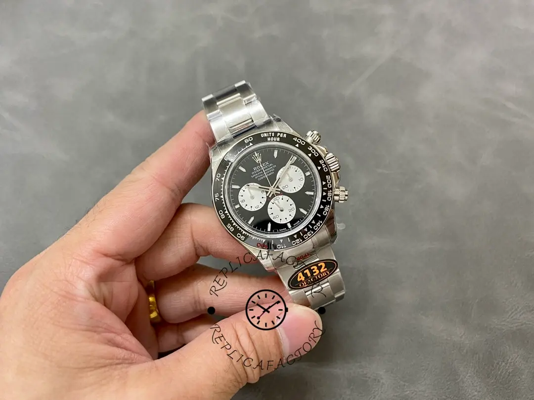 Full watch in-hand view of the Rolex Daytona 126529LN 40MM with bracelet and bezel shown.