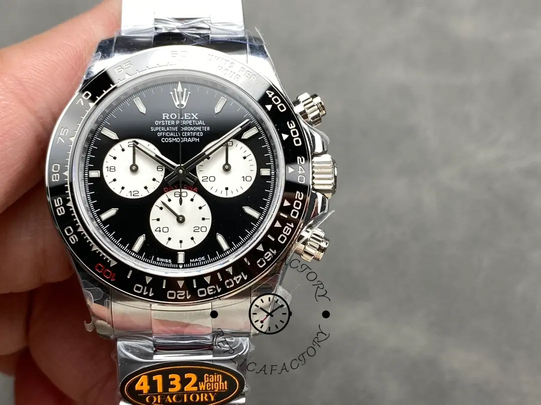 Hand-held front view of the Rolex Daytona 126529LN 40MM showing black dial and white subdials.