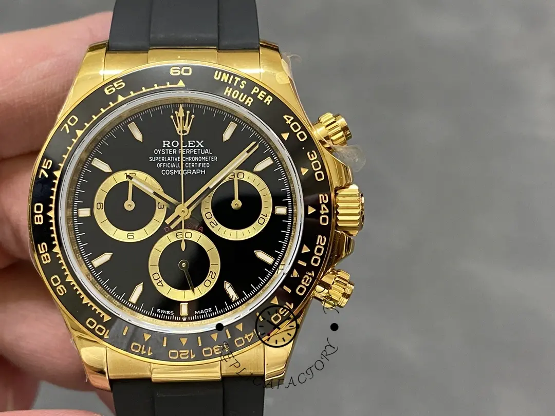 Rolex Daytona 126518LN front view, black dial and gold subdials, yellow gold case.