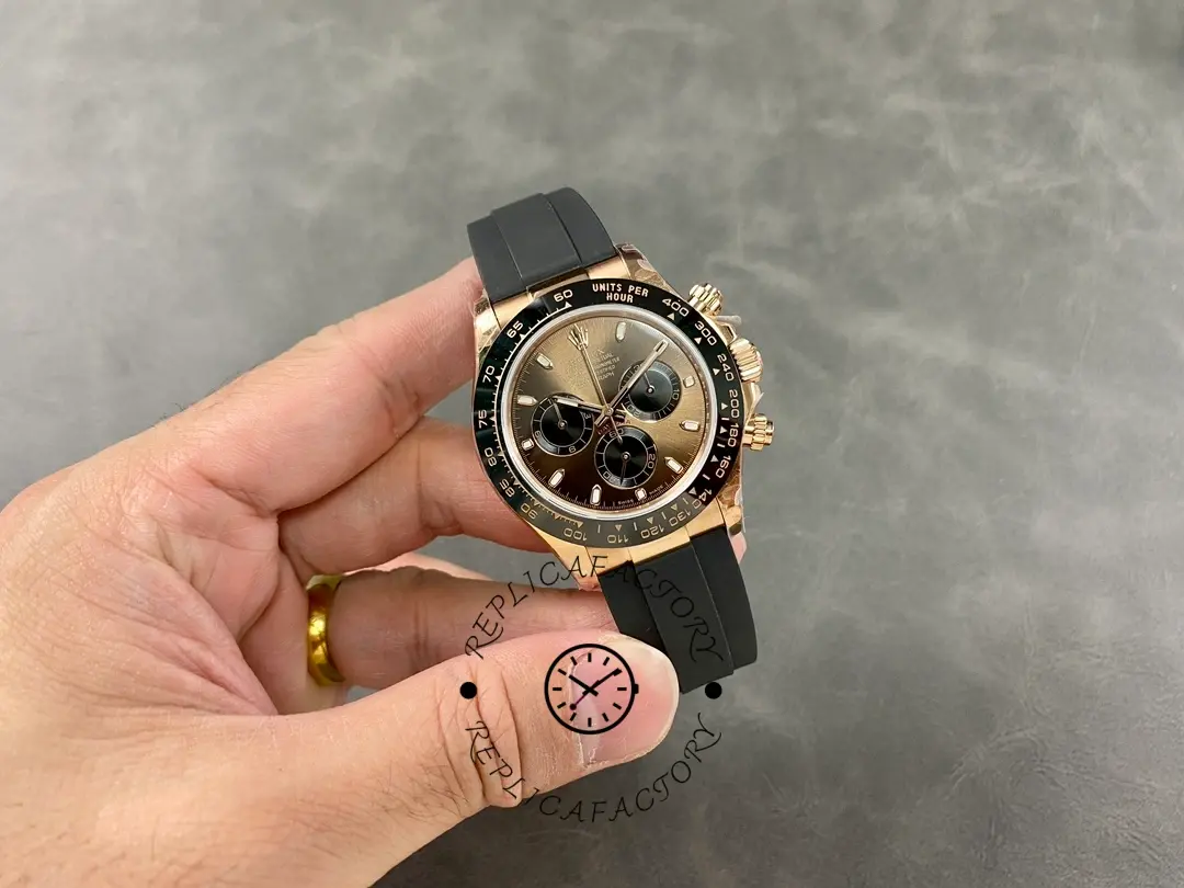 Distant hand-held view of the Rolex Daytona Everose Rubber 116515 Chocolate showing full watch profile.