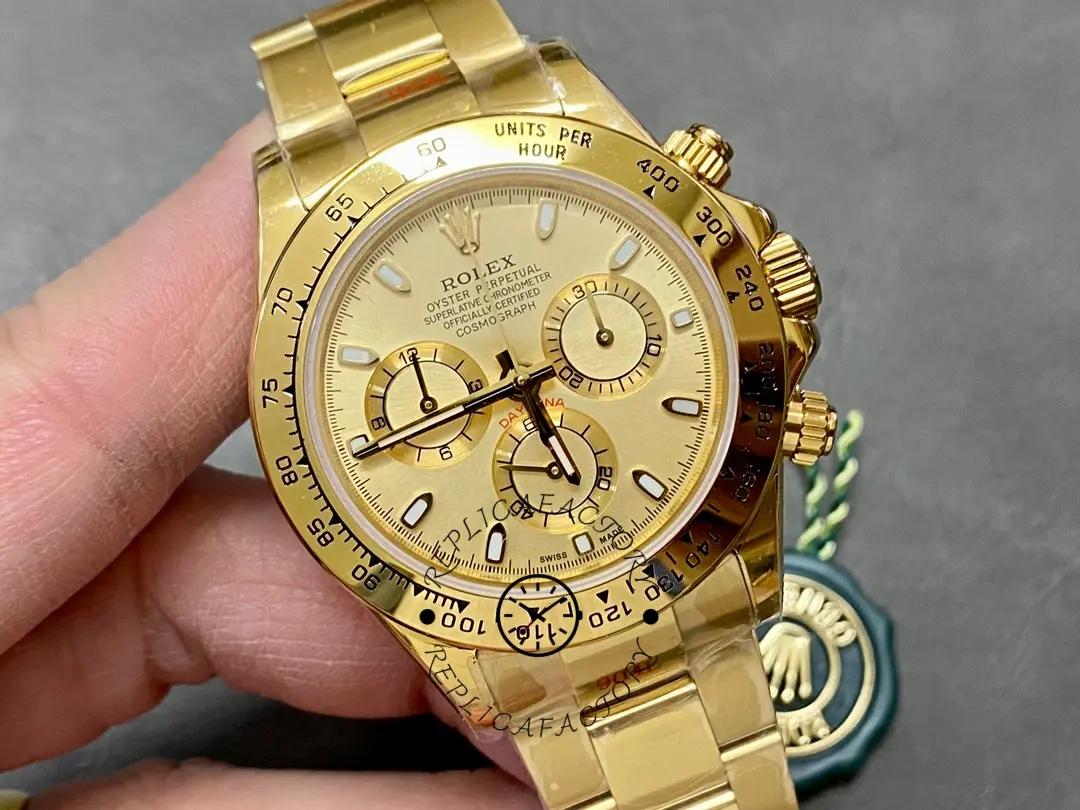 Rolex Daytona 116508 handheld close-up, dial and bezel detail with stickers visible.