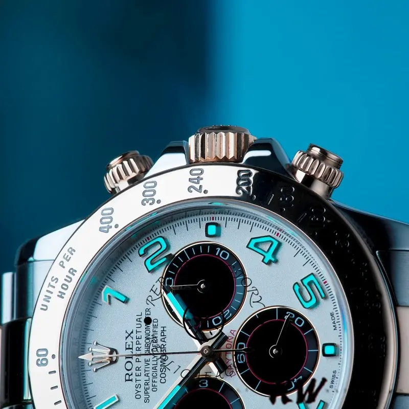 Macro dial view of the Rolex Daytona 116523 40mm highlighting Arabic numerals and subdial rings.