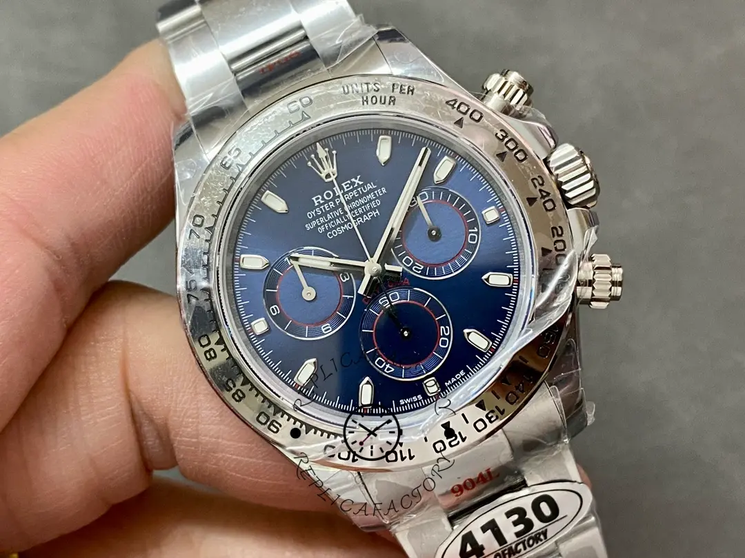 Close hand-held shot of the Rolex Cosmograph Daytona 116509 40MM highlighting bezel and dial.