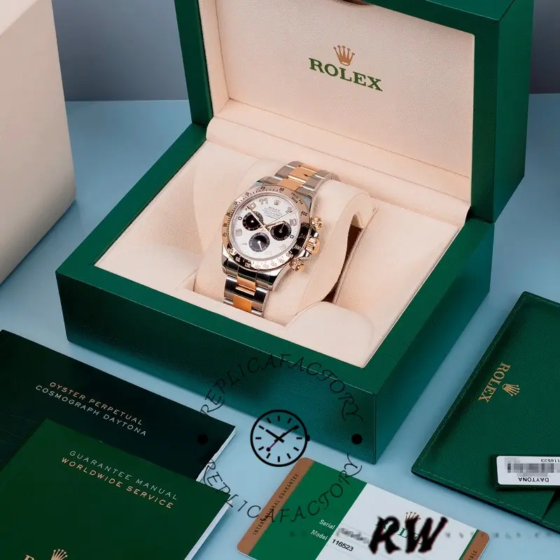 Full set view of the Rolex Daytona 116523 40mm with green box and accessories shown.