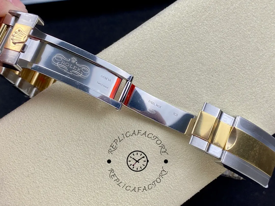 Bracelet open view of the Rolex Daytona 116523 40mm showing two-tone links and clasp inside.