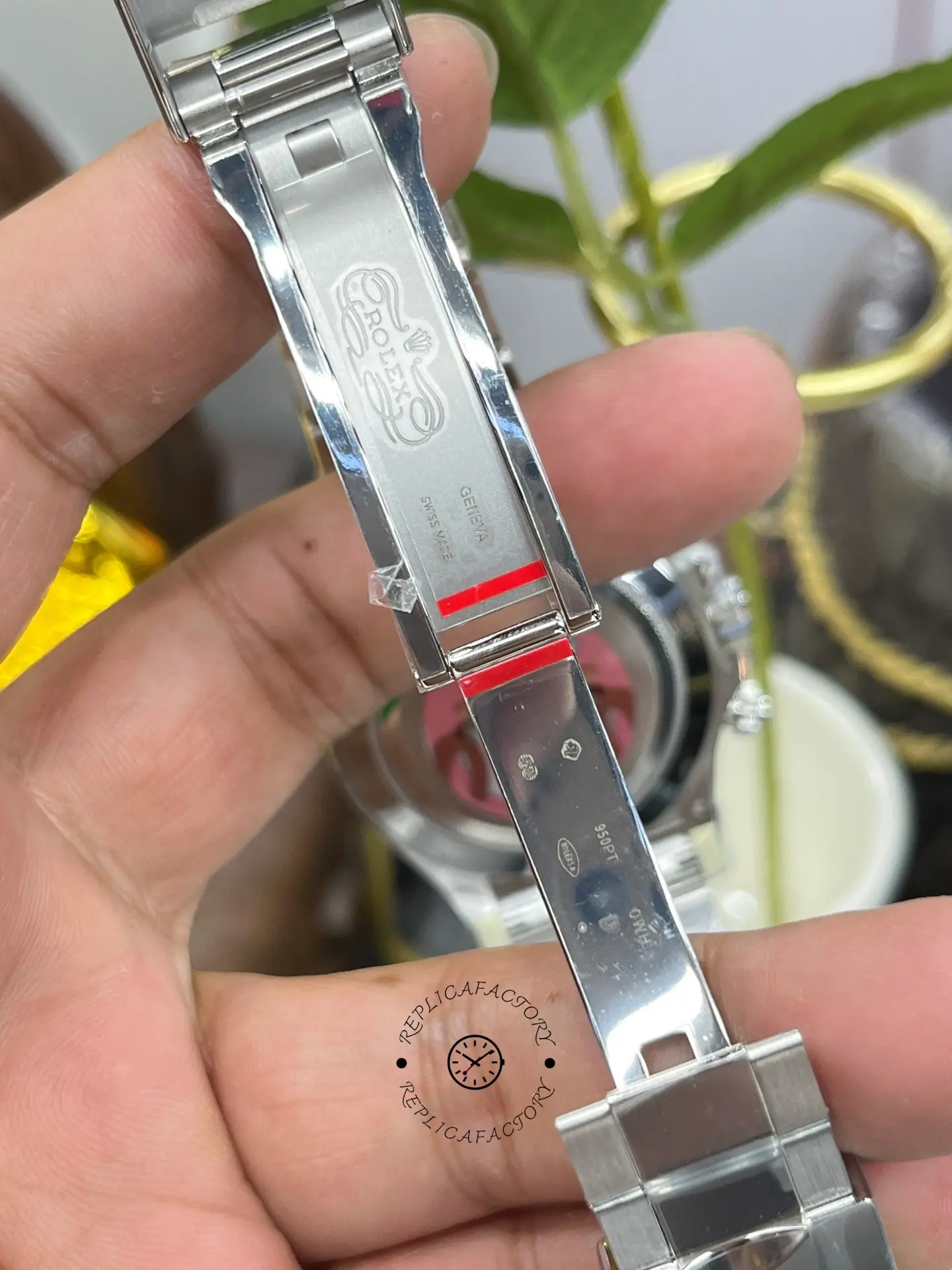 Bracelet detail of Rolex Daytona 116506 showing clasp area with protective film.