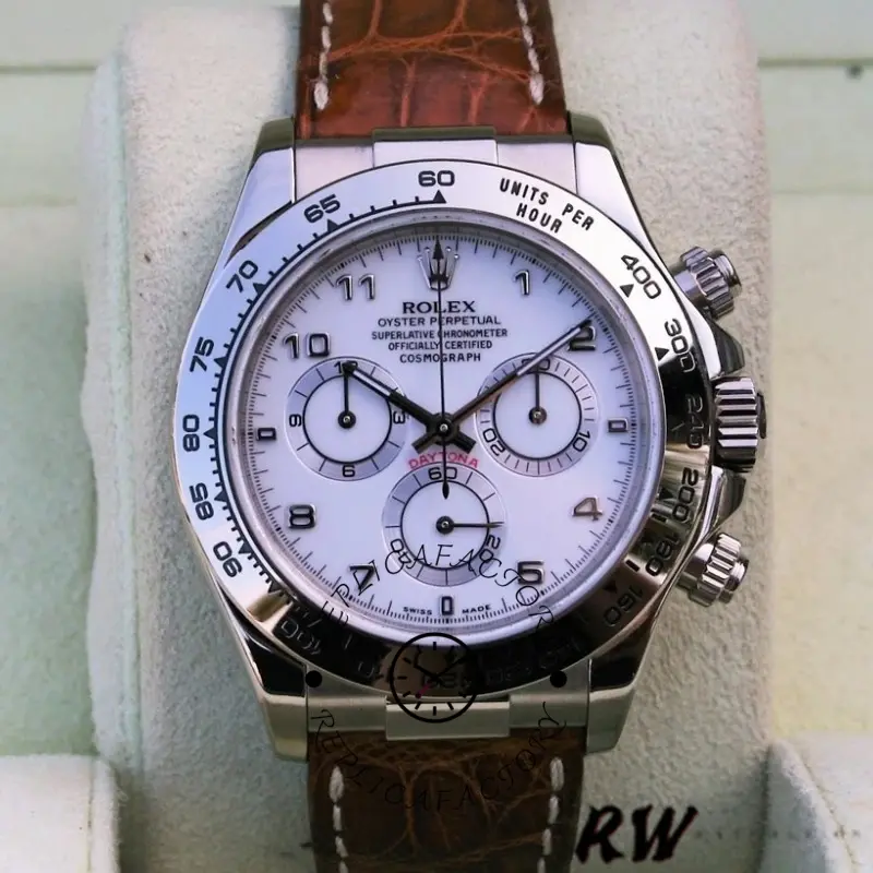 Rolex Daytona 116519 close-up on cushion, white Arabic dial and subdials, brown strap.