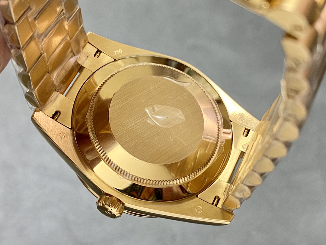 Caseback view of the Rolex Day-Date 228238 showing the smooth gold case and 750 hallmark.