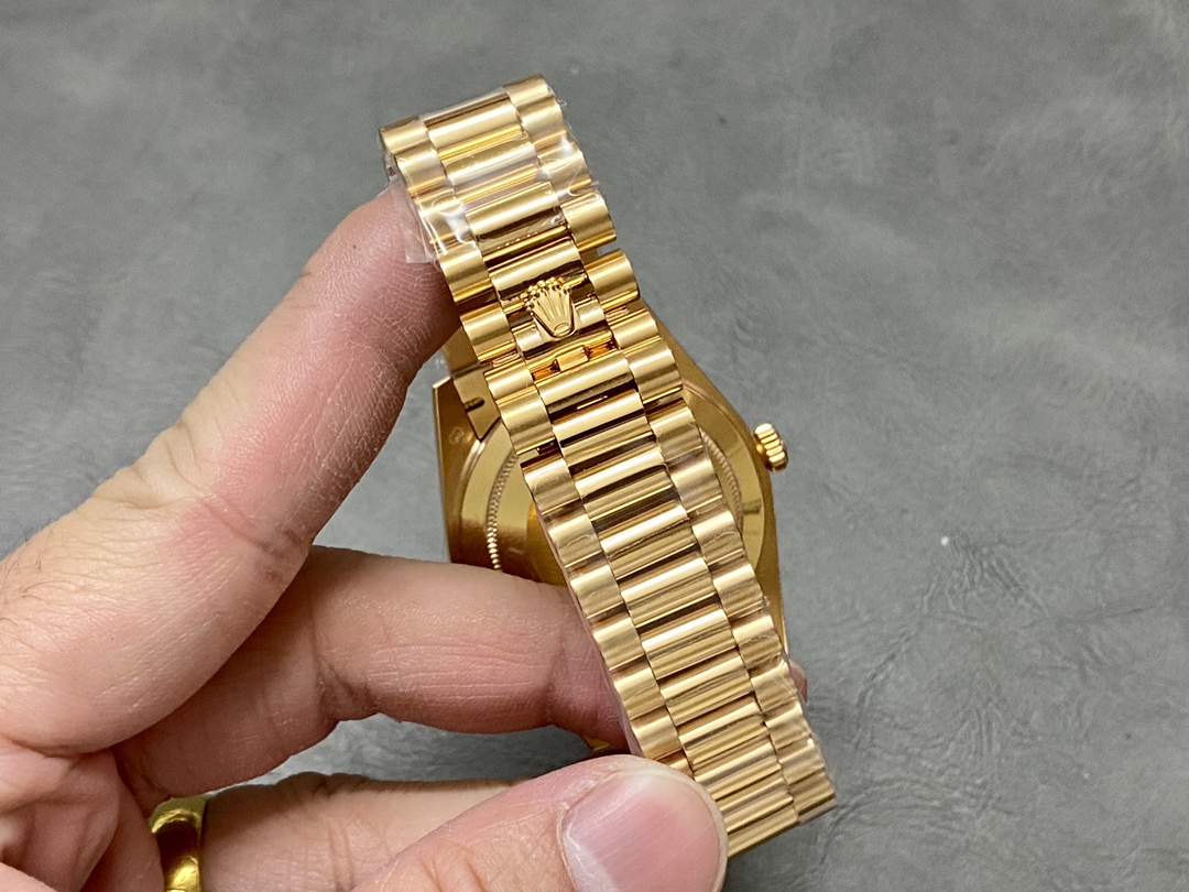 Back view of the Rolex Day-Date 228238 bracelet and clasp with the gold Rolex crown emblem.