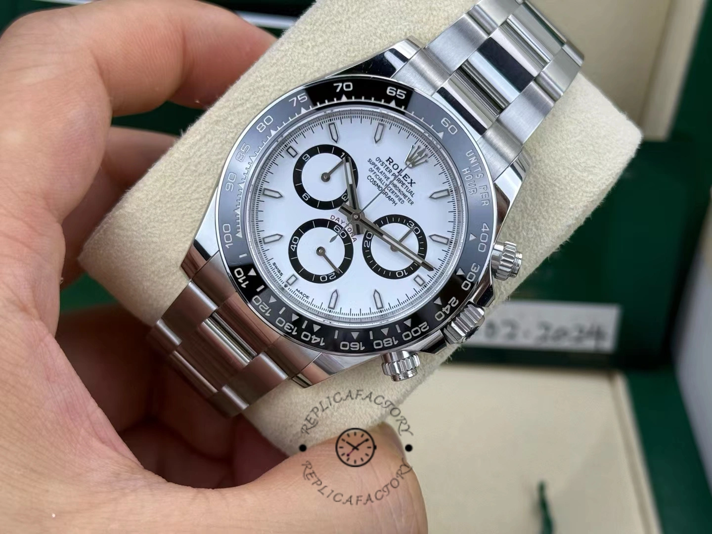 Close-up front view of Rolex Cosmograph Daytona 116500LN showing dial details, subdials, and ceramic bezel in worn condition