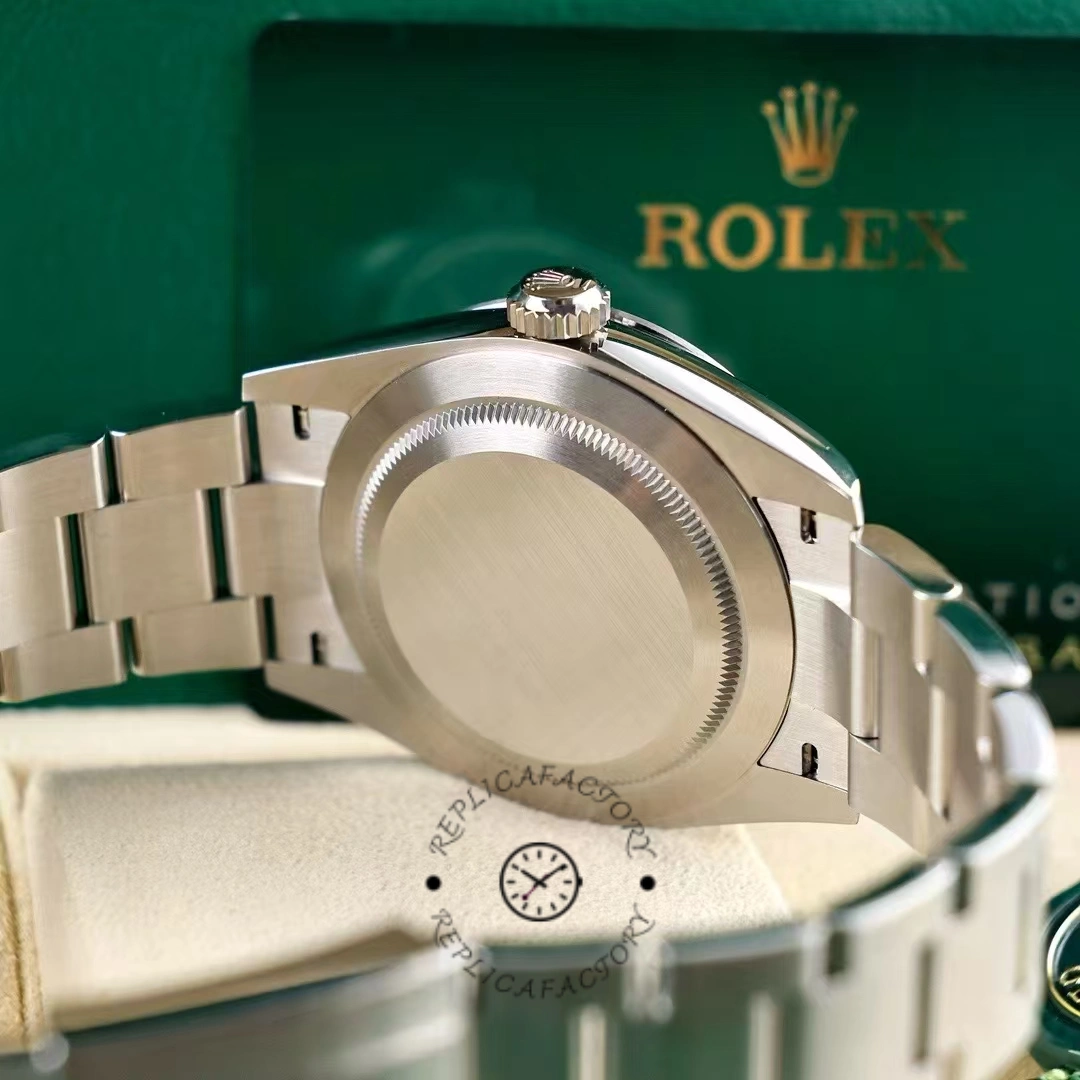 Caseback view of Rolex Explorer 224270 with brushed finish and green Rolex card behind.
