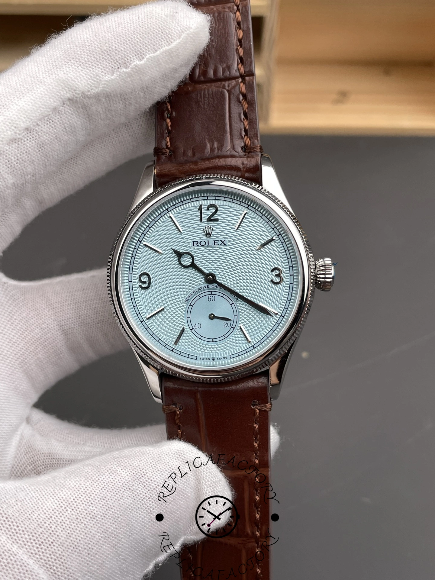 Angled front view of Rolex 1908 52506 highlighting fluted bezel and domed crystal.