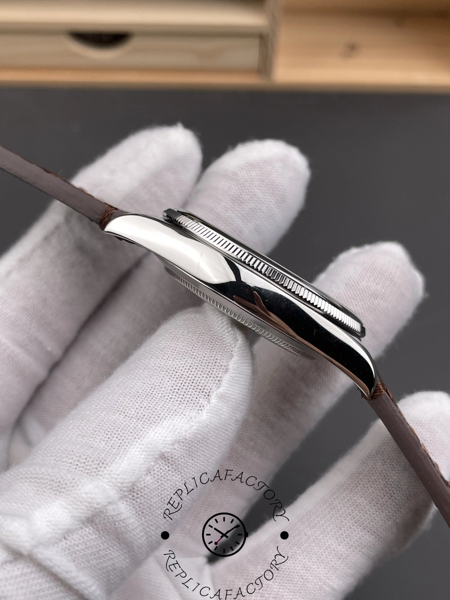 Left profile of Rolex 1908 52506 highlighting slim platinum case.