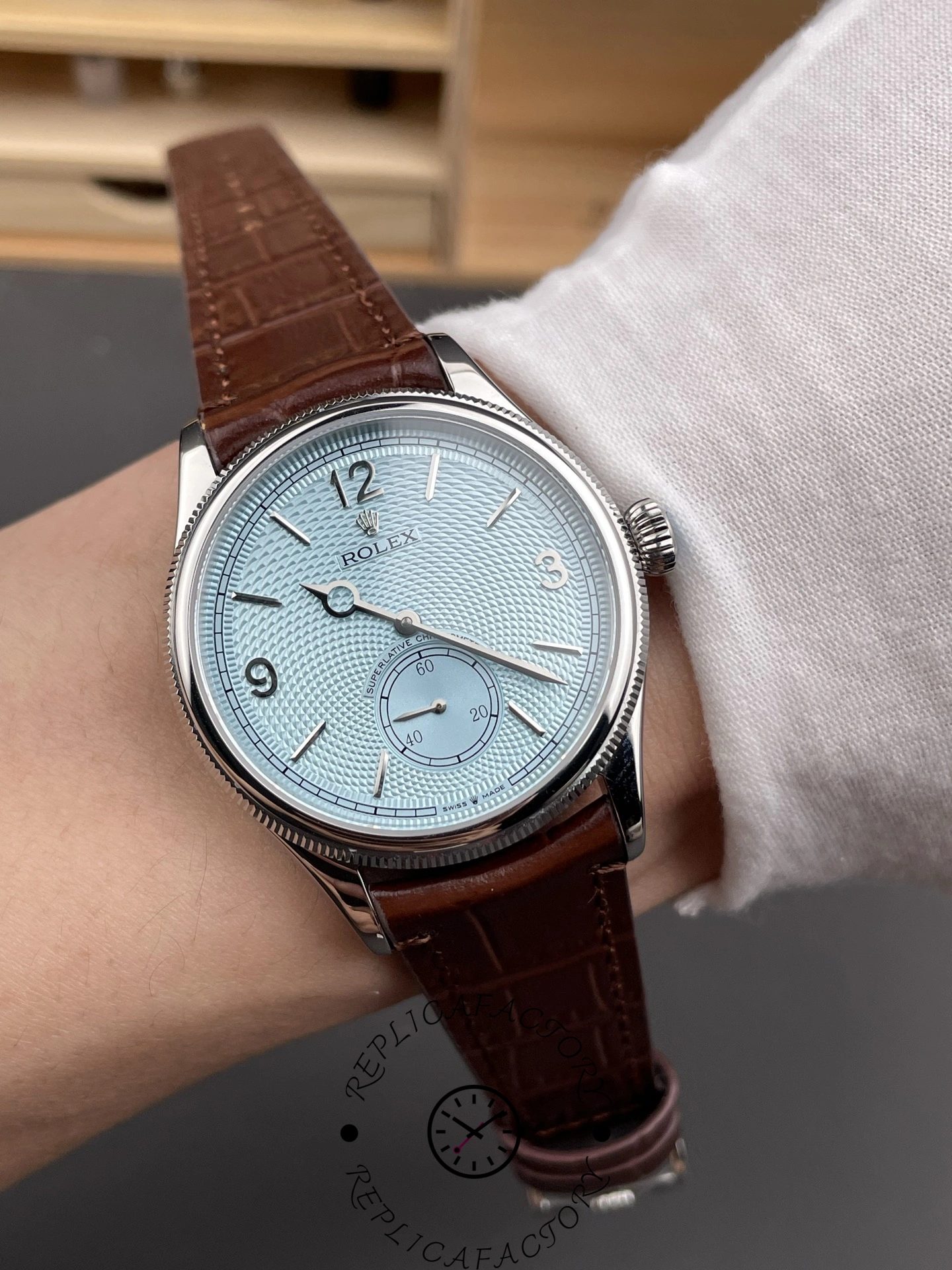 Wrist shot of Rolex 1908 52506 platinum with brown alligator strap.