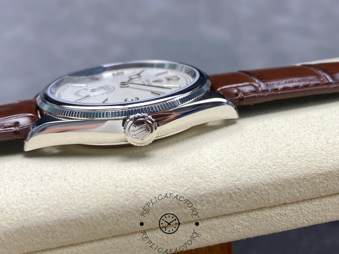 Side profile of Rolex Perpetual 1908 52509-0006 showing fluted crown with Rolex logo.