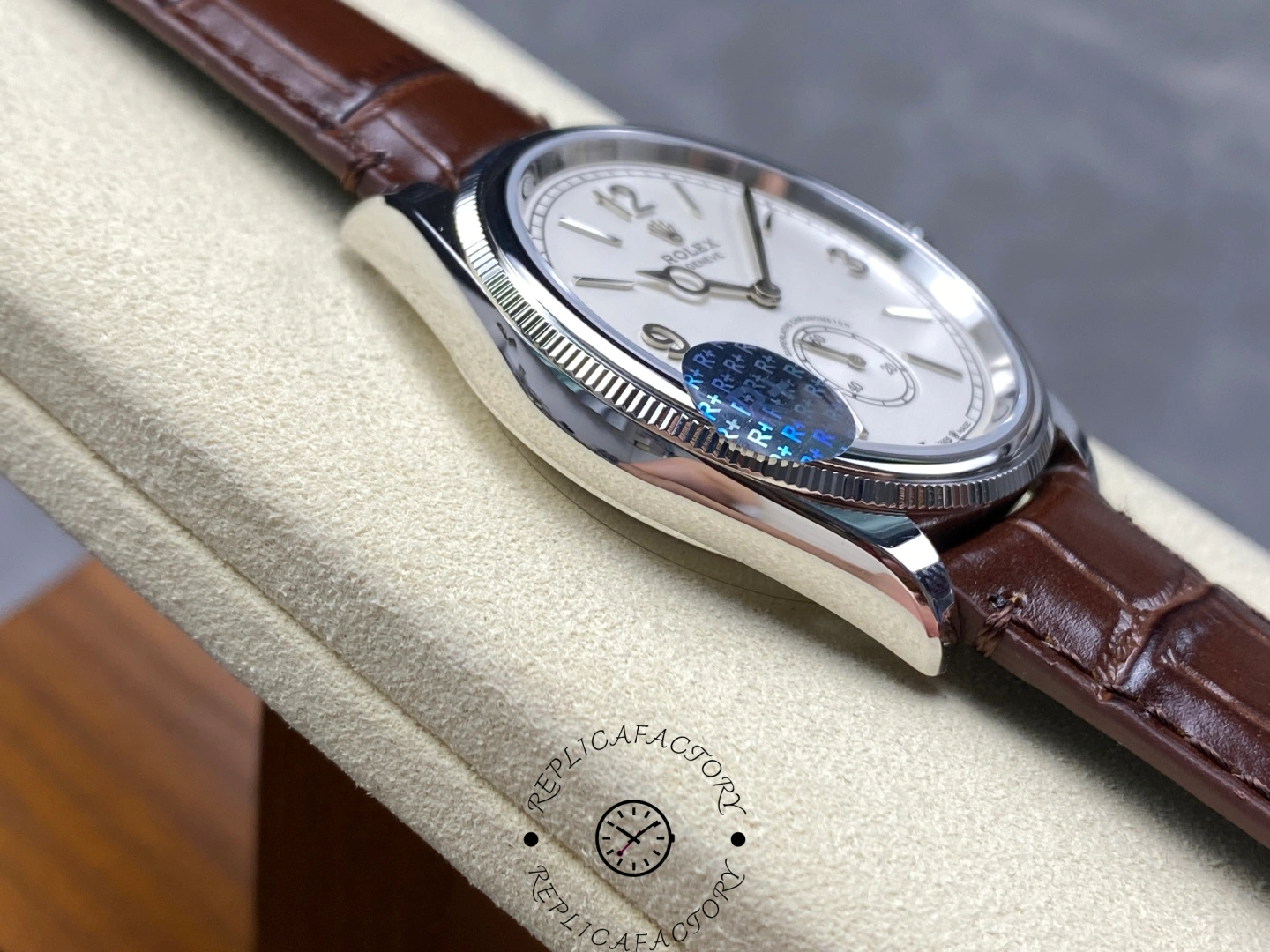 Side angle of Rolex Perpetual 1908 52509-0006 revealing curved lugs and leather strap connection.