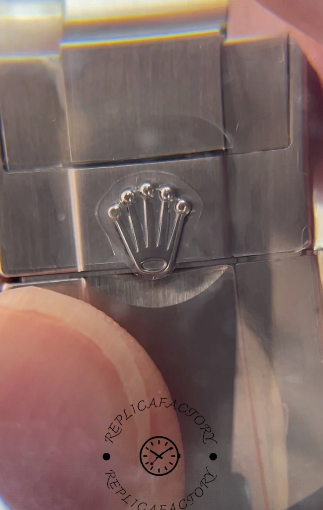 Macro view of Rolex clasp engraving showing the Rolex crown logo on Daytona 116500LN-0001.