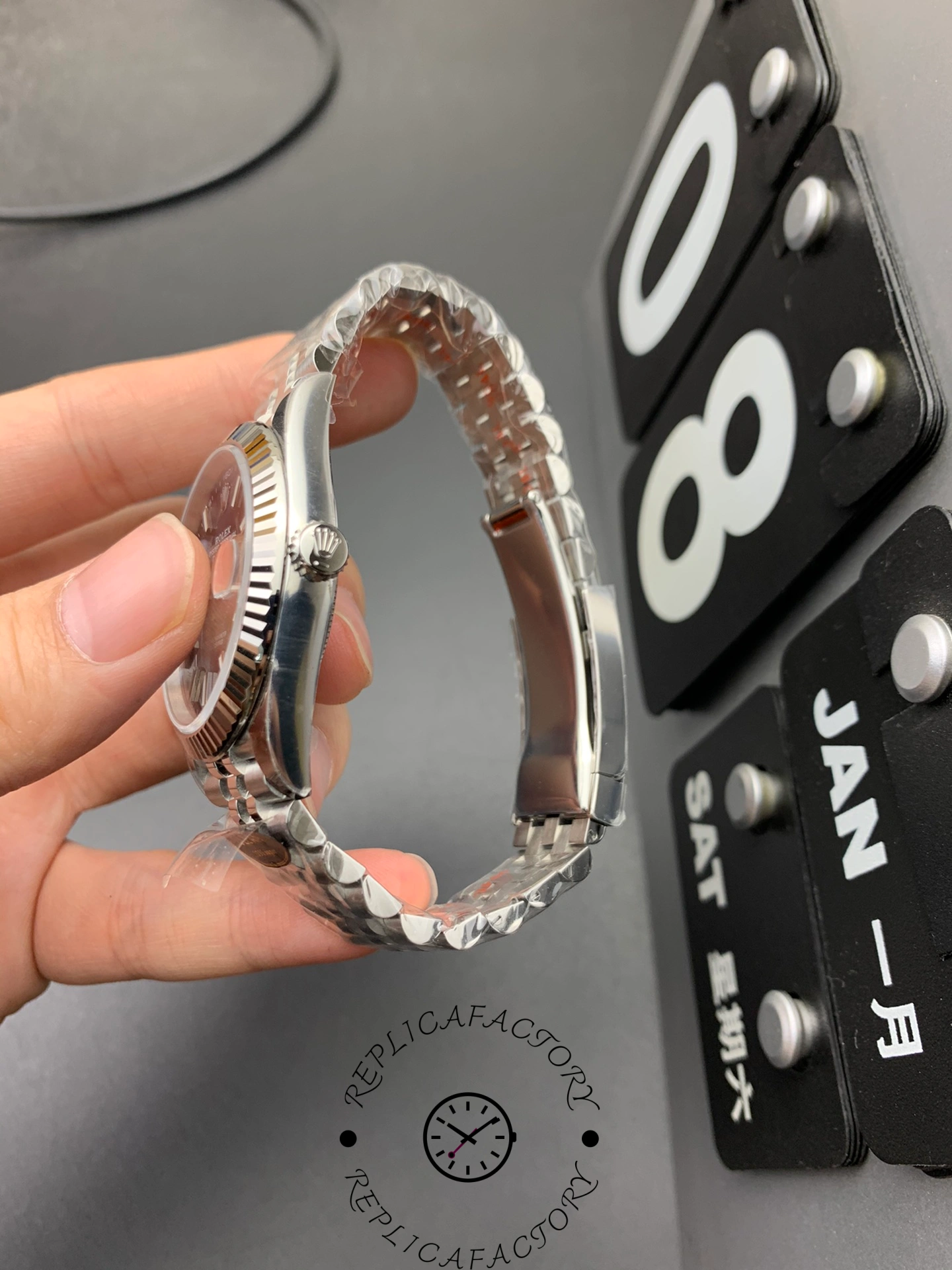 Reverse side view of the Rolex Datejust 126334-0002 showing the screw-down crown and bracelet curvature.