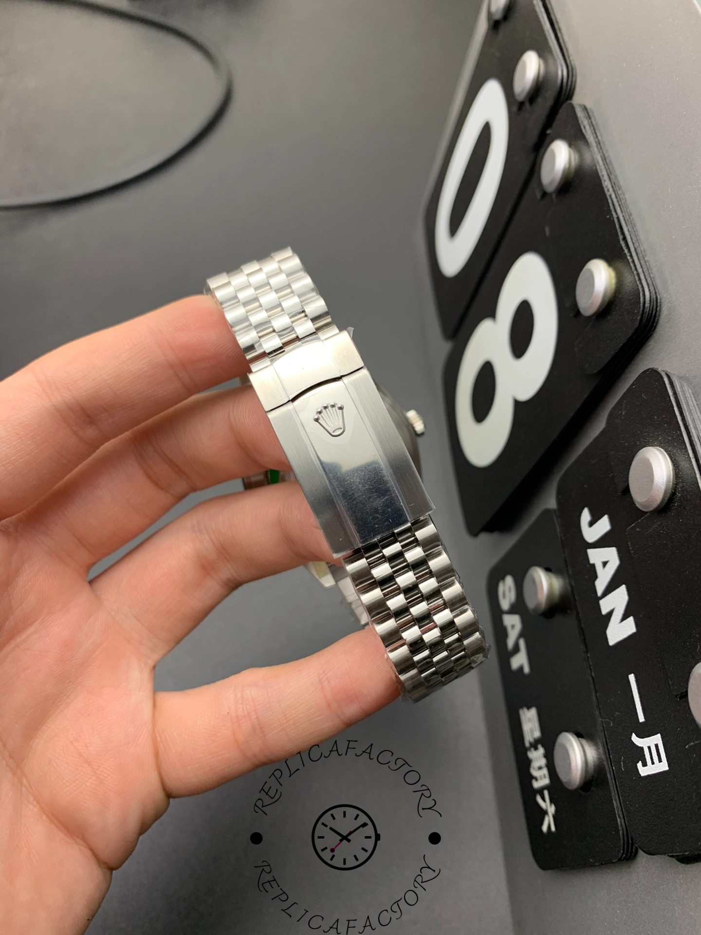 Clasp view of the Rolex Datejust 126334-0002 showing polished clasp with raised Rolex crown logo.