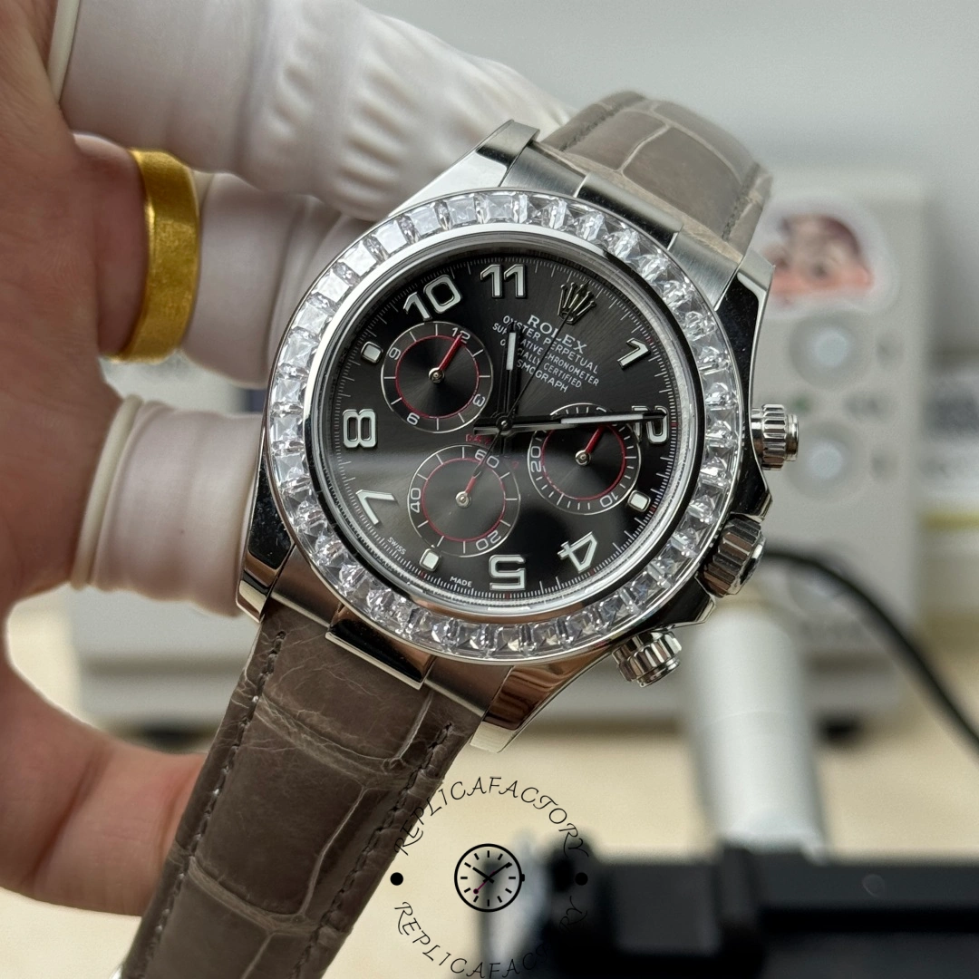 Handheld view of Rolex Daytona 116509 gray dial with diamond bezel and red accents.