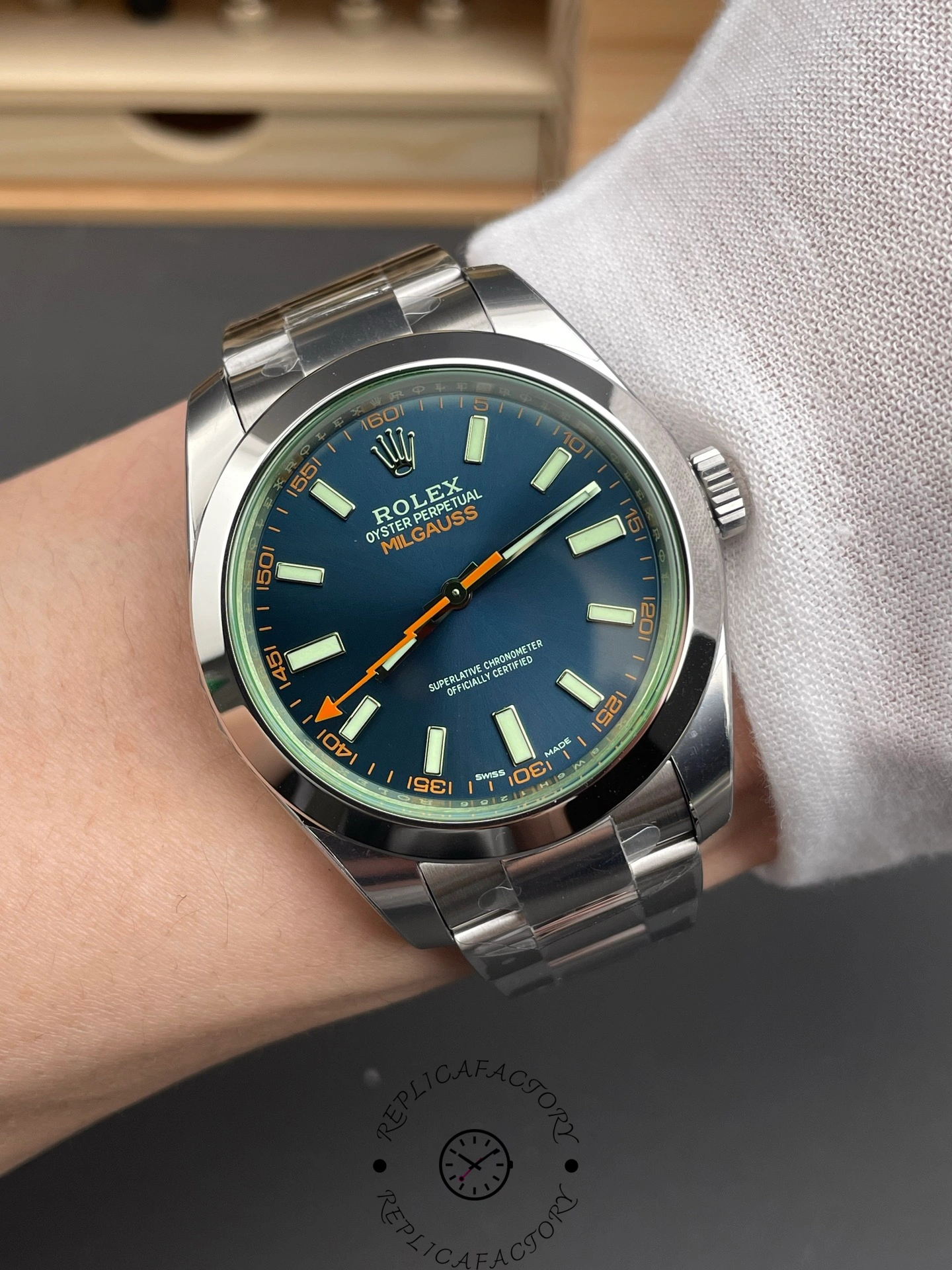 Wrist shot of Rolex Milgauss 116400GV showing blue dial and orange lightning hand.