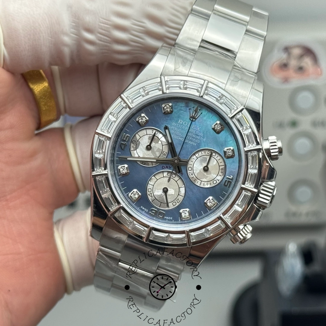 Handheld view of Rolex Daytona 116589 with ice blue MOP dial and chronograph subdials.