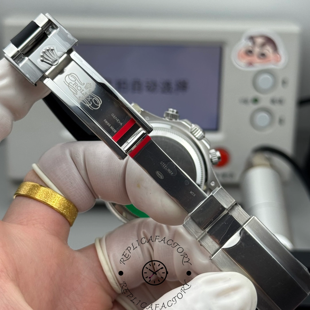 Inner clasp view of the Rolex Cosmograph Daytona 126519LN-0006 showing Rolex Geneva engravings and steel markings.