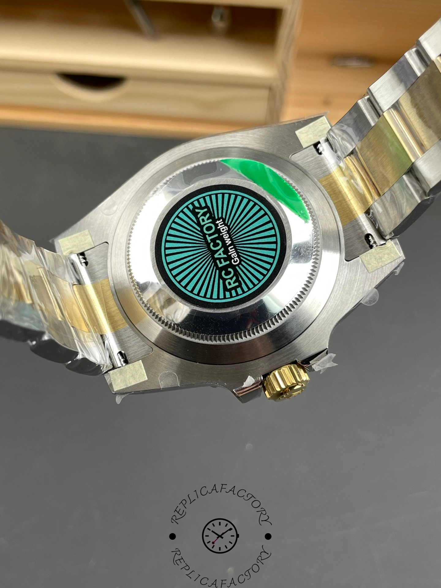 Caseback of the Rolex Submariner 116613LB featuring RC Factory label.