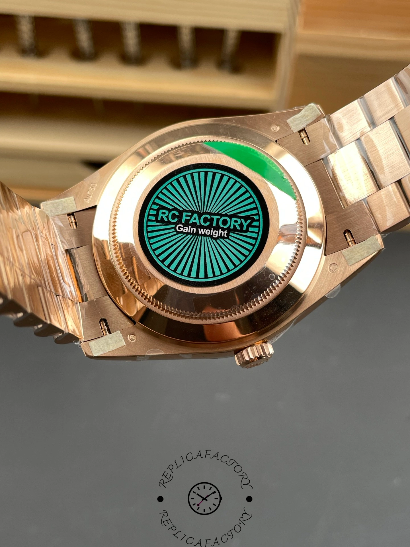 Back view of the Rolex Day-Date 40 Everose gold showing the case back with RC Factory label.