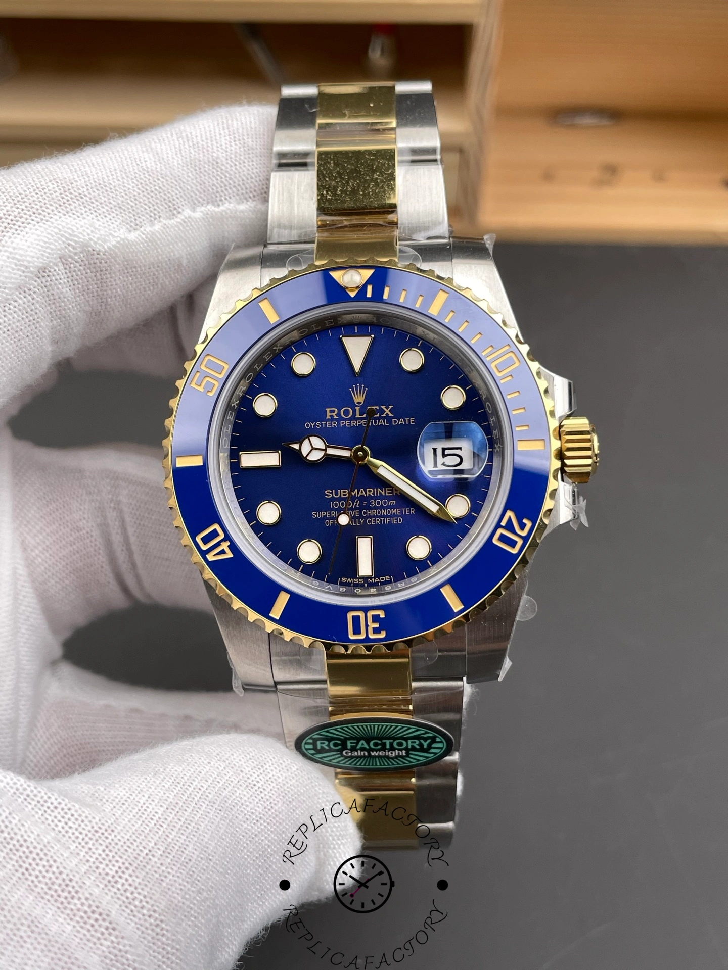 Front close-up of the Rolex Submariner Date 116613LB two-tone watch with blue dial and ceramic bezel.