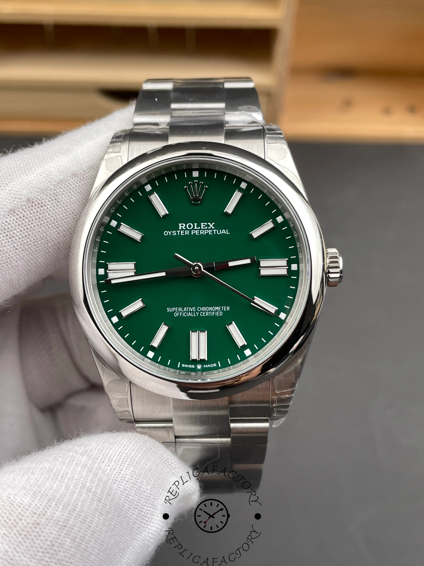 Full front view of the Rolex Oyster Perpetual 41 green dial watch, clearly displaying its classic design.