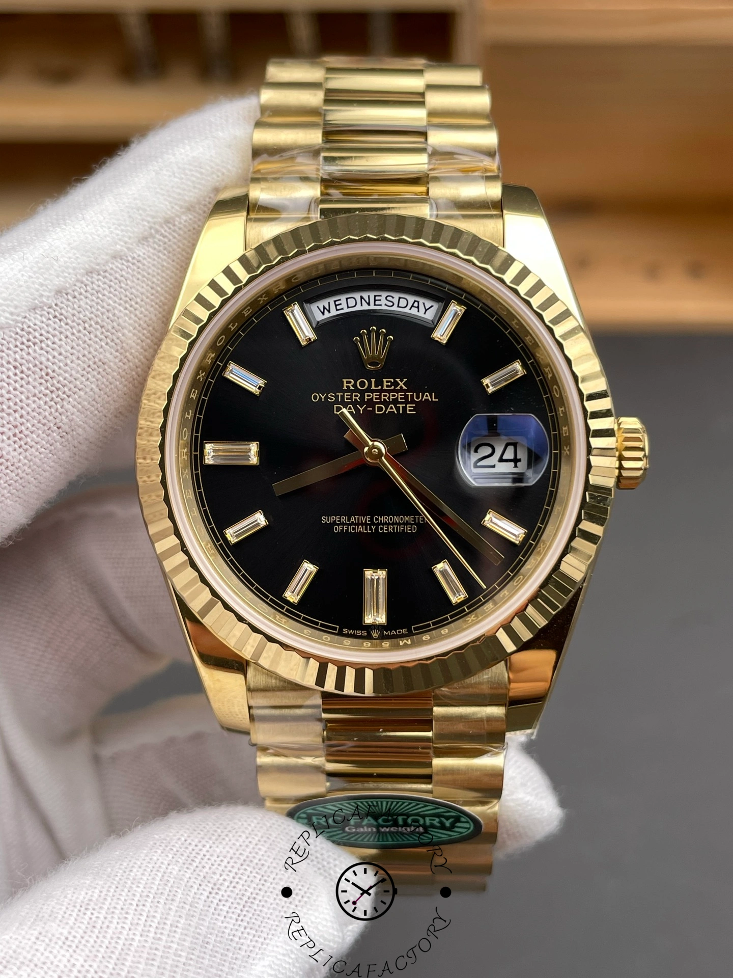 Straight-on view of the Rolex Day-Date 228238 highlighting the fluted bezel and gold President bracelet.