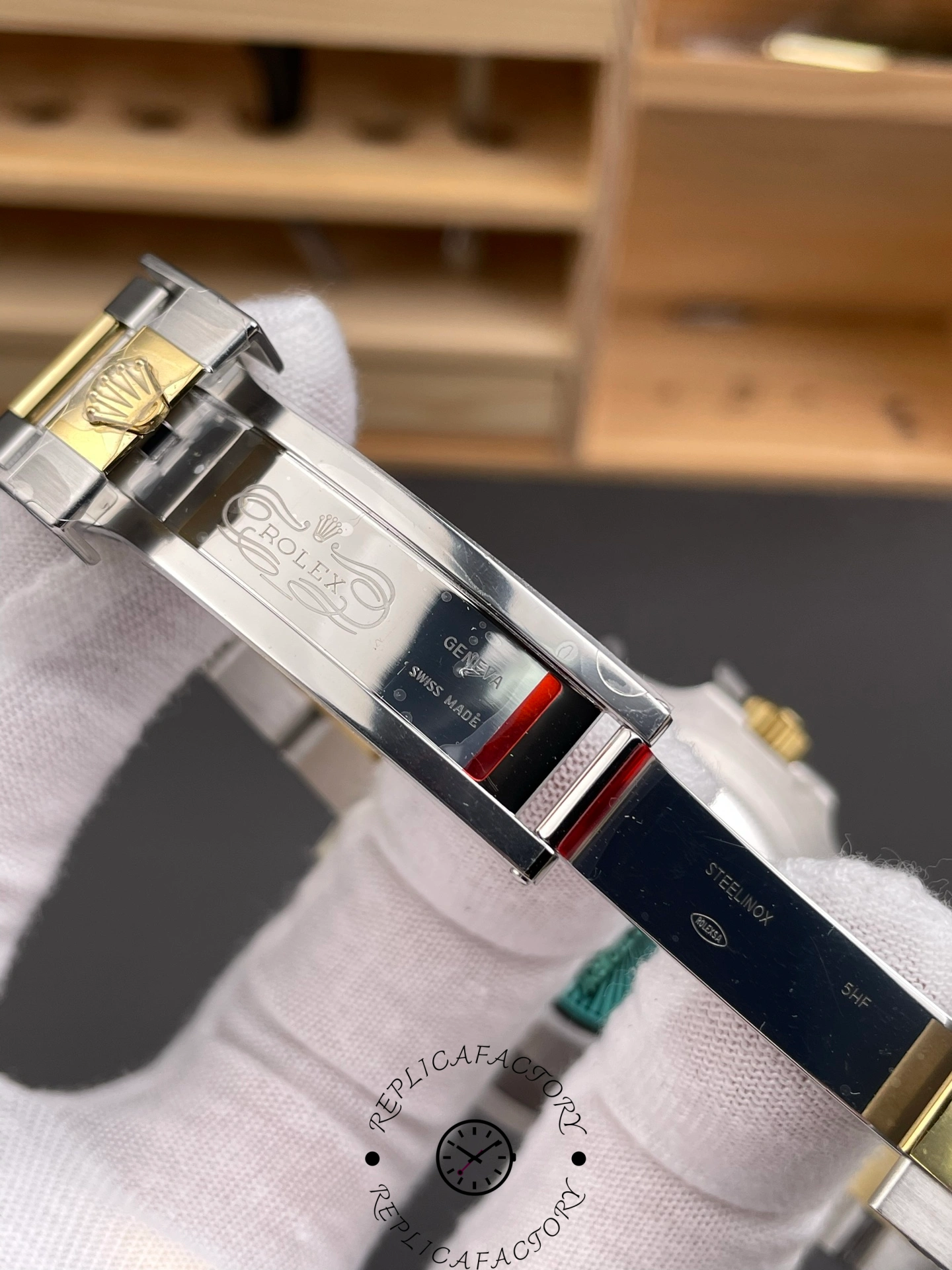 Inside view of the Rolex Submariner 116613LB clasp engraved with Rolex Geneva Swiss Made markings.