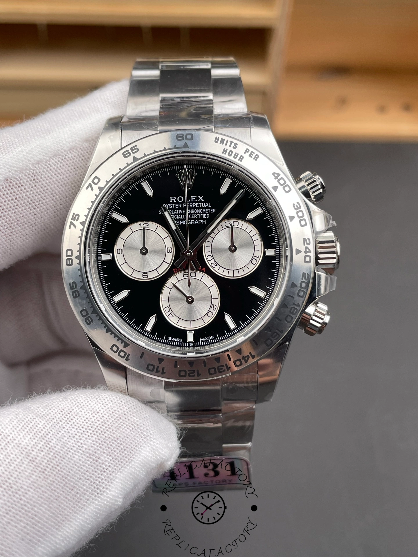Straight-on front view of the Rolex Daytona 126509-0001 highlighting its black dial and polished stainless steel case.