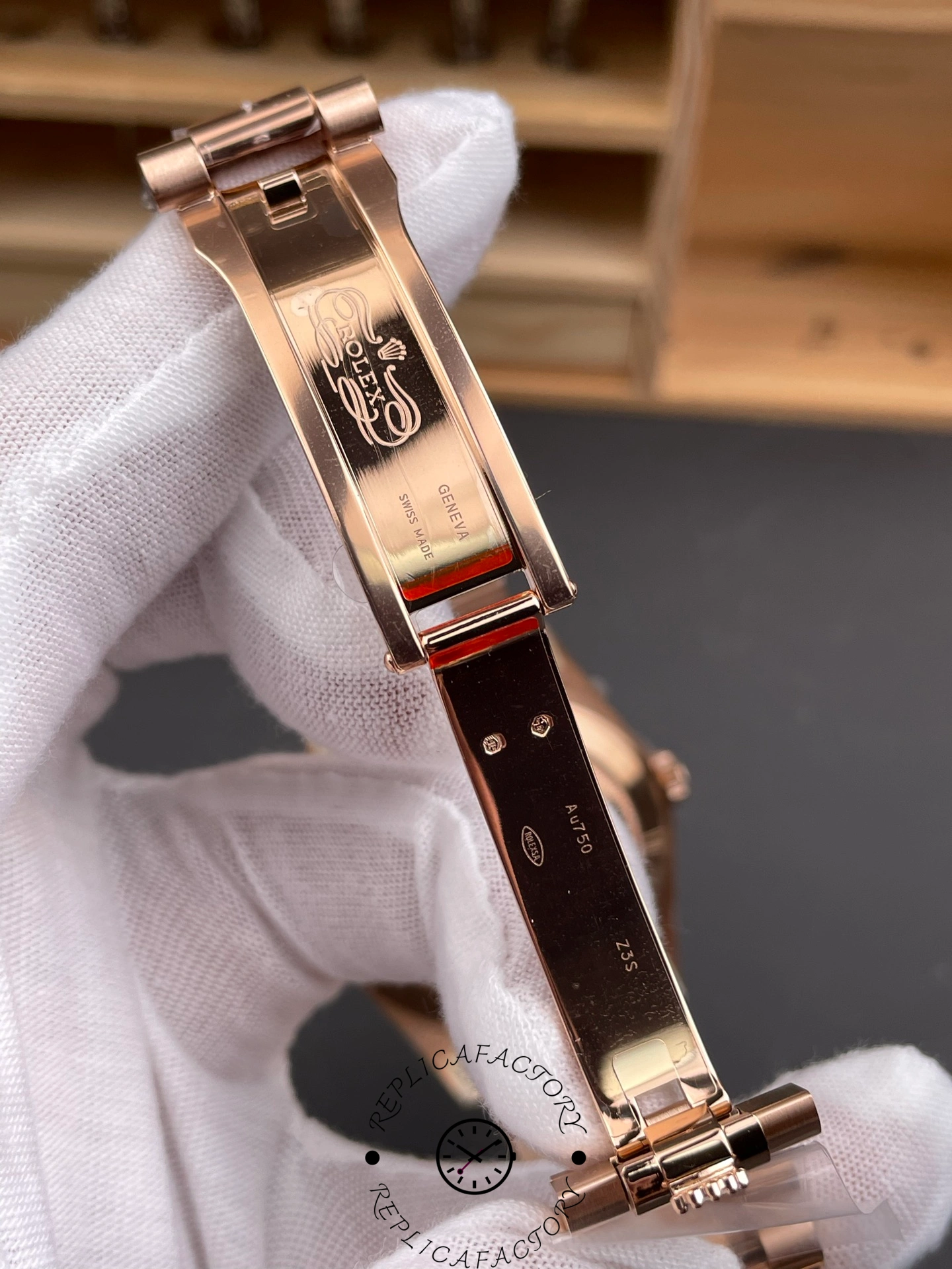 Inside view of the Rolex Day-Date 40 clasp engraved with Rolex Geneva Swiss Made markings.