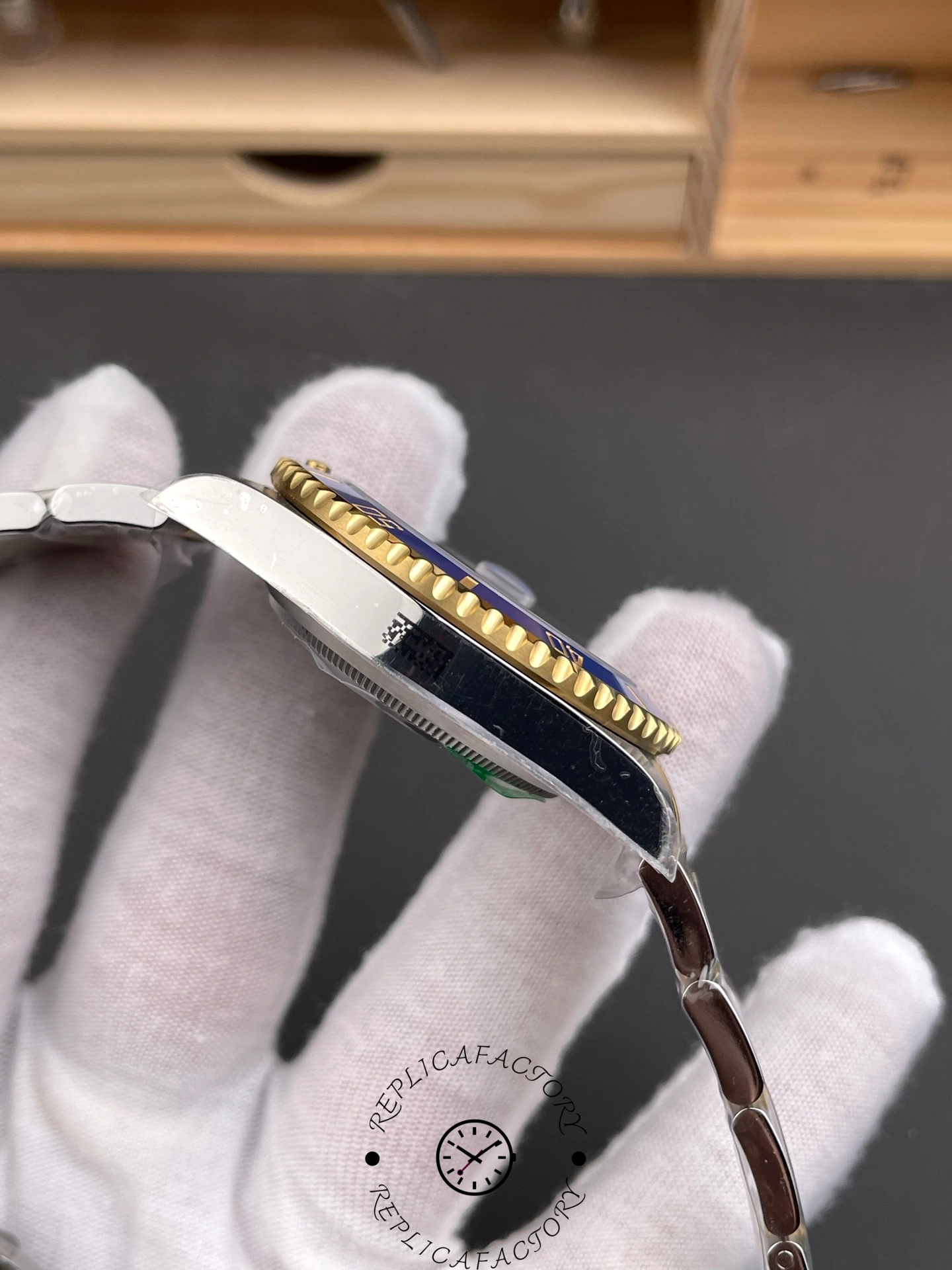 Alternate side view of the Rolex Submariner 116613LB showing case thickness and bezel teeth detail.