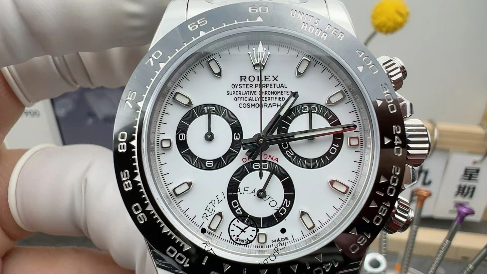 Close-up of the Rolex Cosmograph Daytona M126500LN-0001 white dial showing chronograph subdials and polished markers.