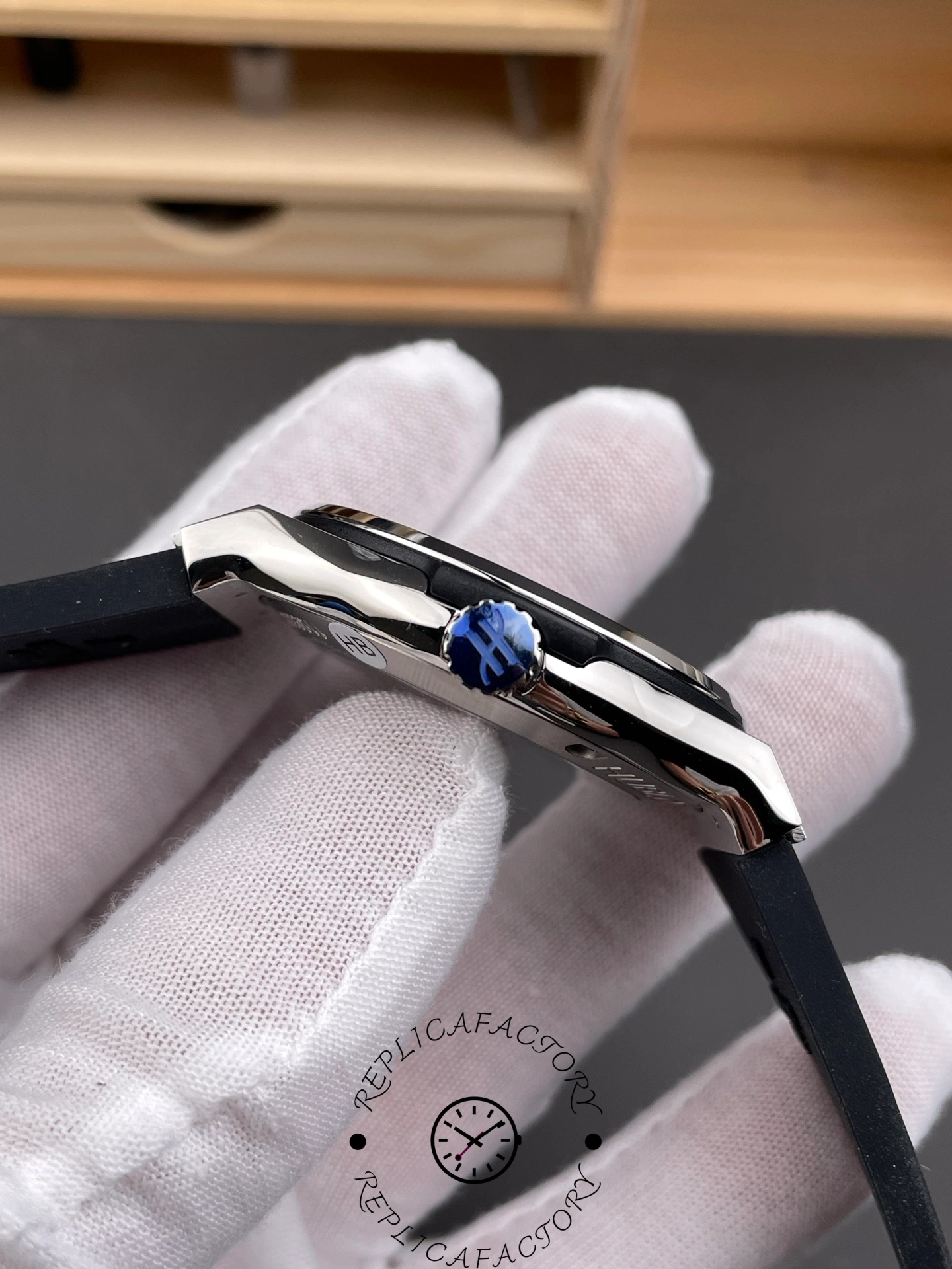 Crown close-up of Hublot Classic Fusion 542.NX.1171.RX with engraved Hublot logo.