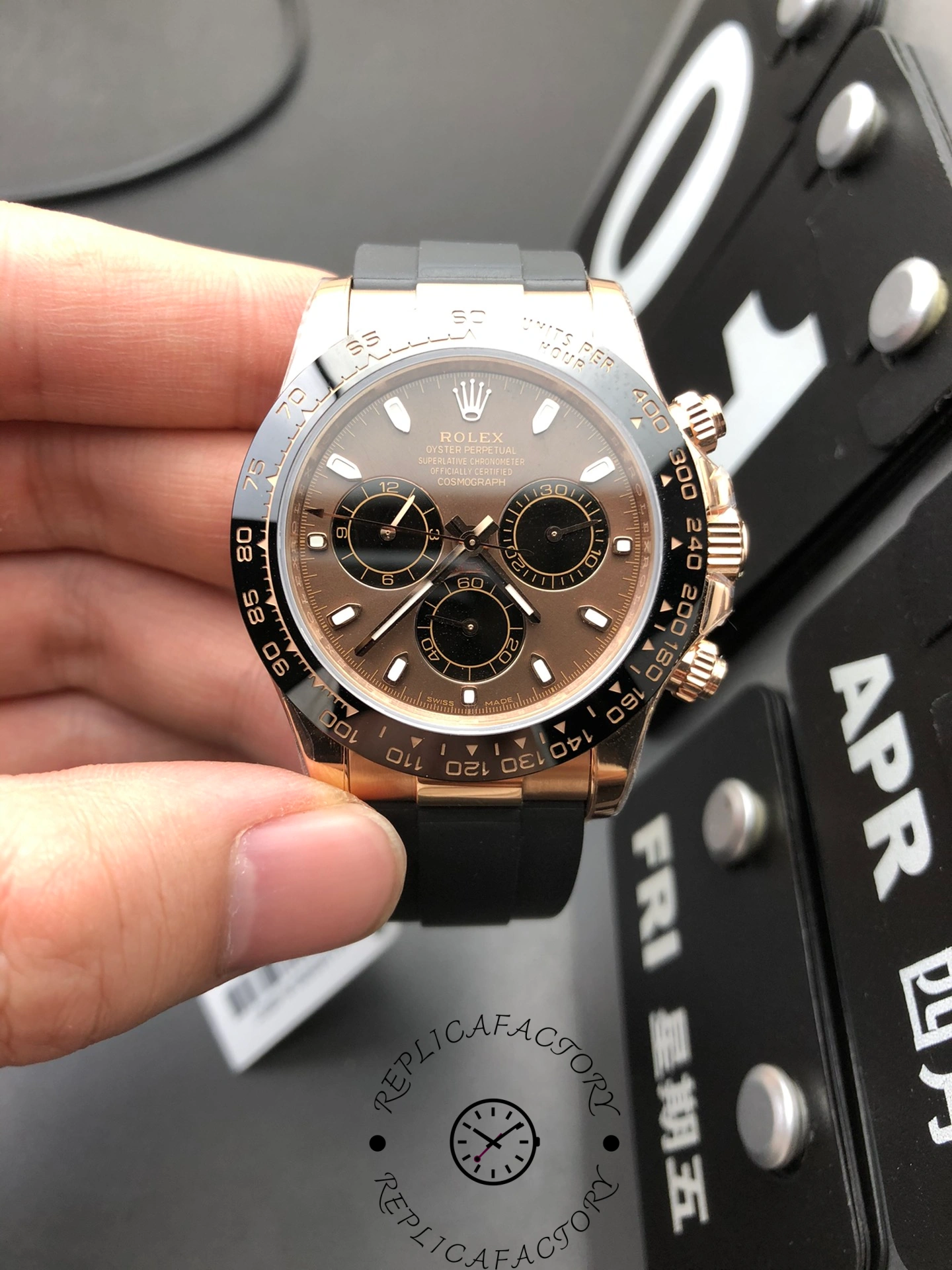 Front view of Rolex Cosmograph Daytona 126515LN-0010 replica watch in Everose gold with black dial and ceramic bezel.