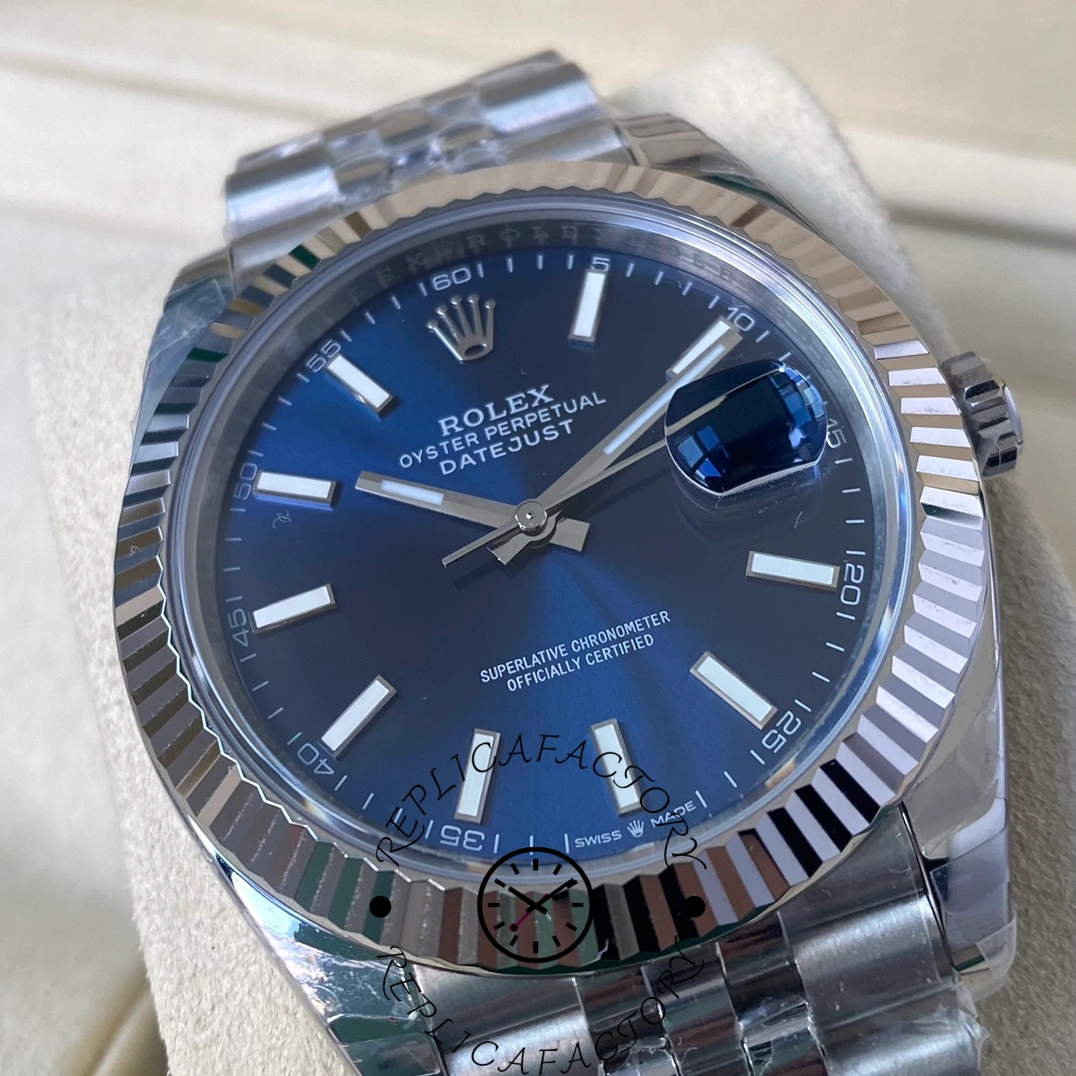 Macro shot of the Rolex Datejust 126334-0002 blue dial showing applied hour markers and the Cyclops date magnifier.