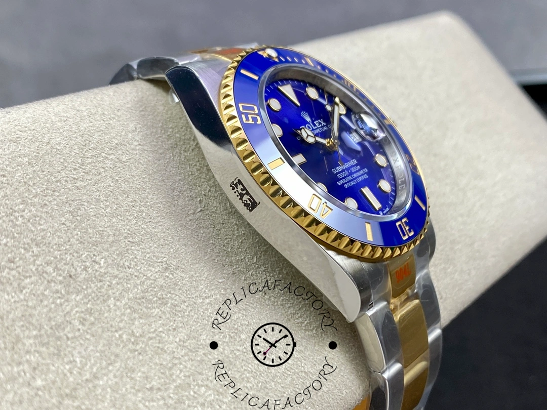 Side profile of the Rolex Submariner 126613LB showing polished case flank and gold center links.