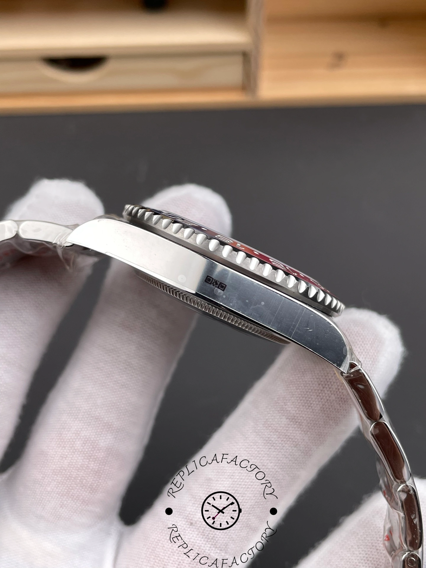 Left profile of the Rolex GMT-Master II 126719BLRO-0002 showing case thickness and ceramic bezel detail.