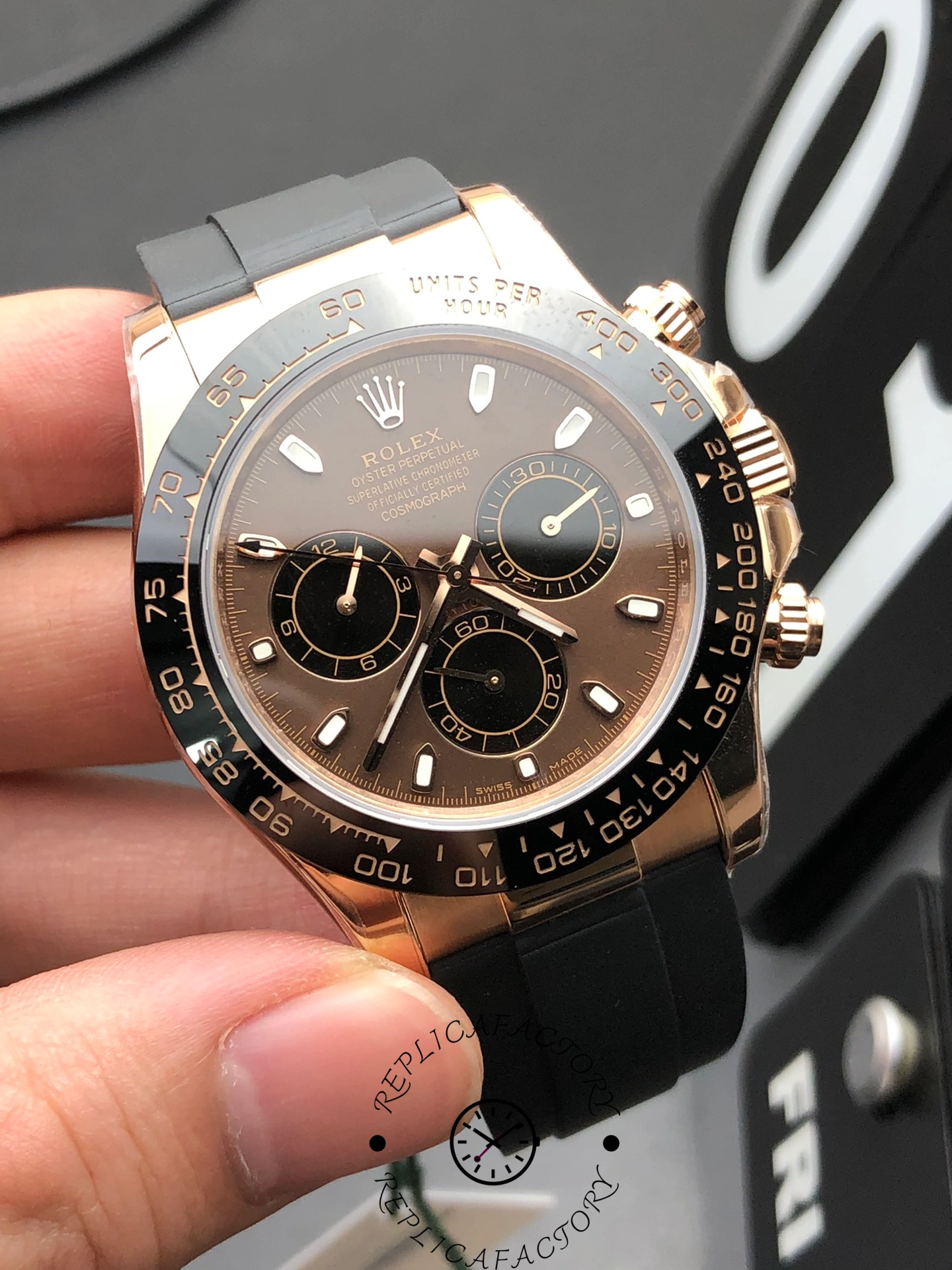 Angled front close-up showing Rolex Cosmograph Daytona 126515LN-0010 black dial with gold subdials and Everose case.