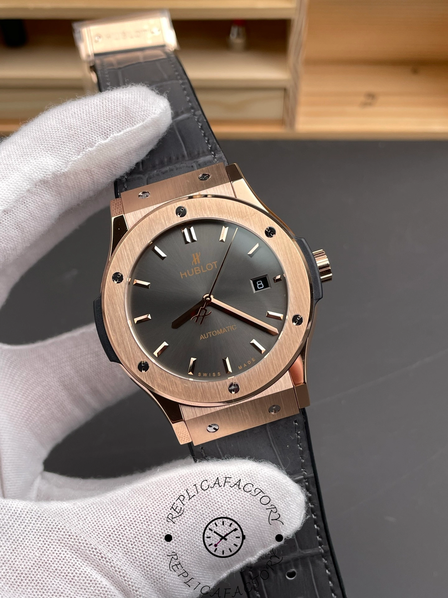 Angled front view of Hublot Classic Fusion 511.OX.7081.LR replica with polished indices and date window.