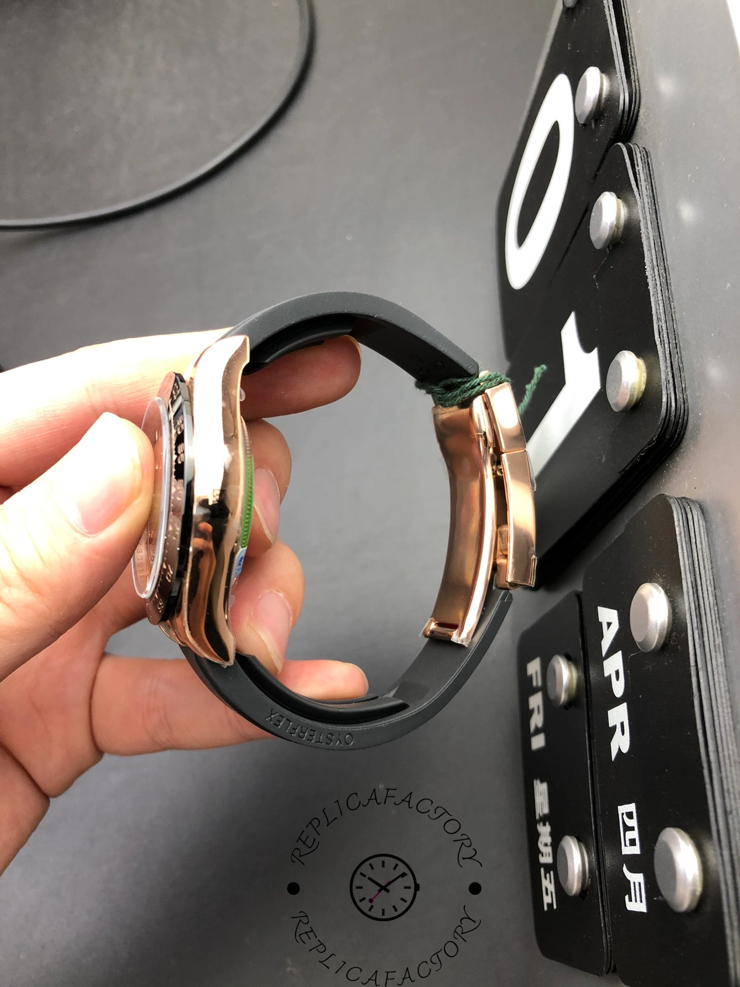 Left side profile of Rolex Cosmograph Daytona 126515LN-0010 with Everose gold case and curved rubber strap.