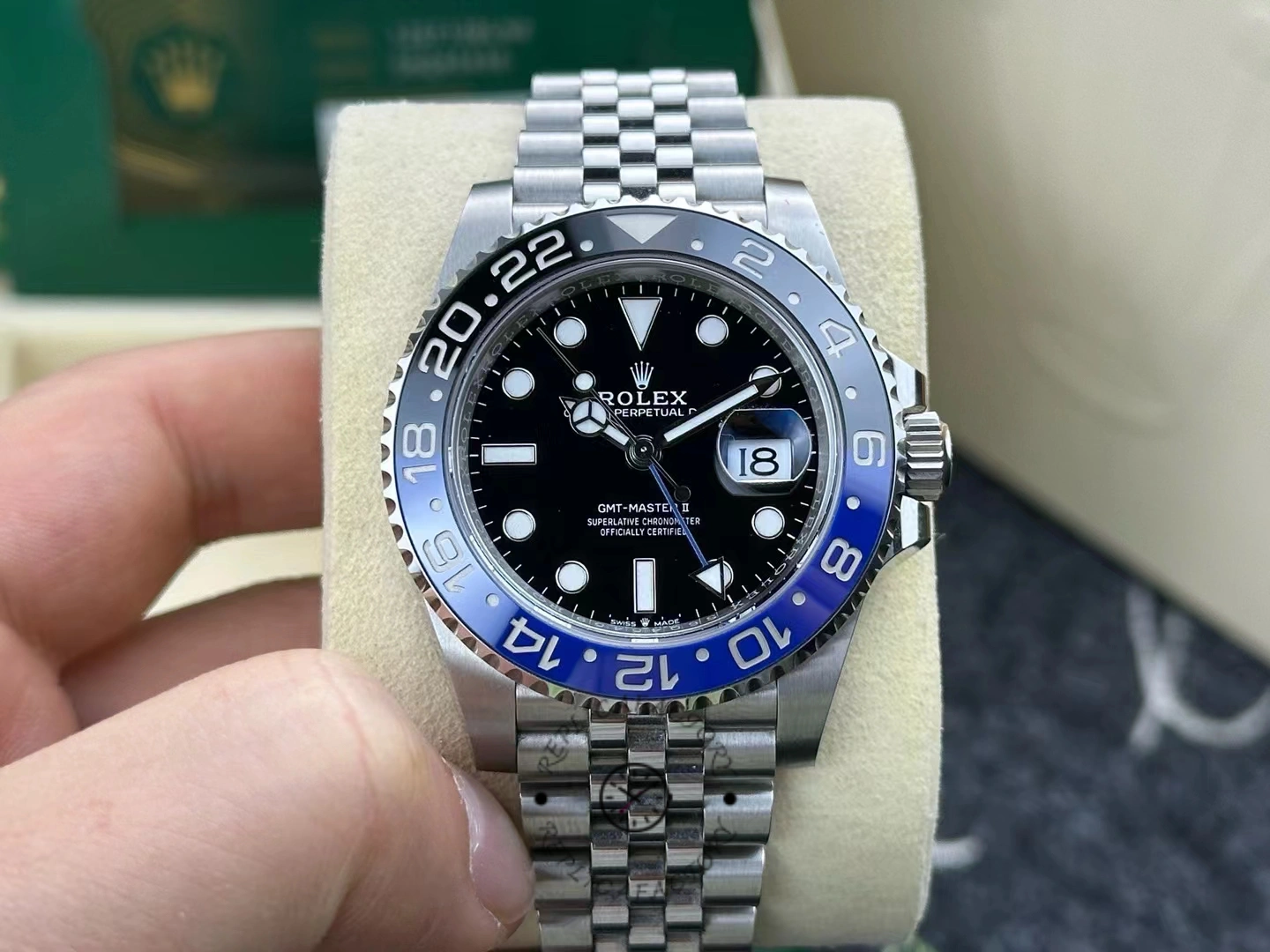Front view of pre-owned Rolex GMT-Master II 126710BLNR-0002 after one year of wear, showing blue-black ceramic bezel and black dial.