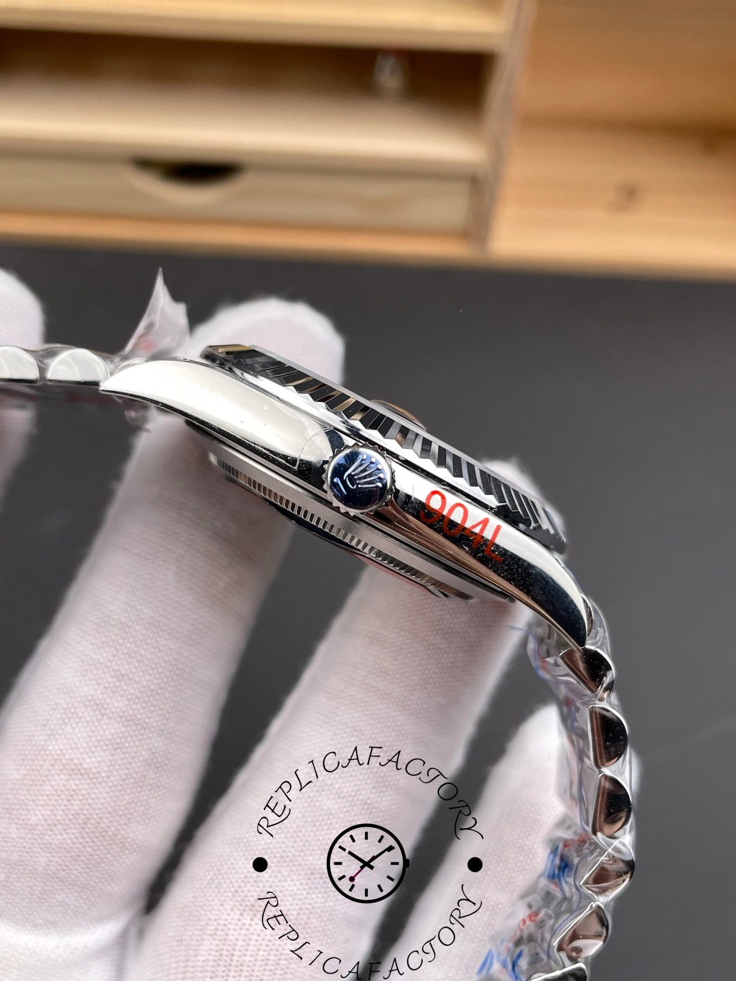 Crown side view of the Rolex Datejust 126334-0018 showing engraved Rolex crown logo and polished case finish.