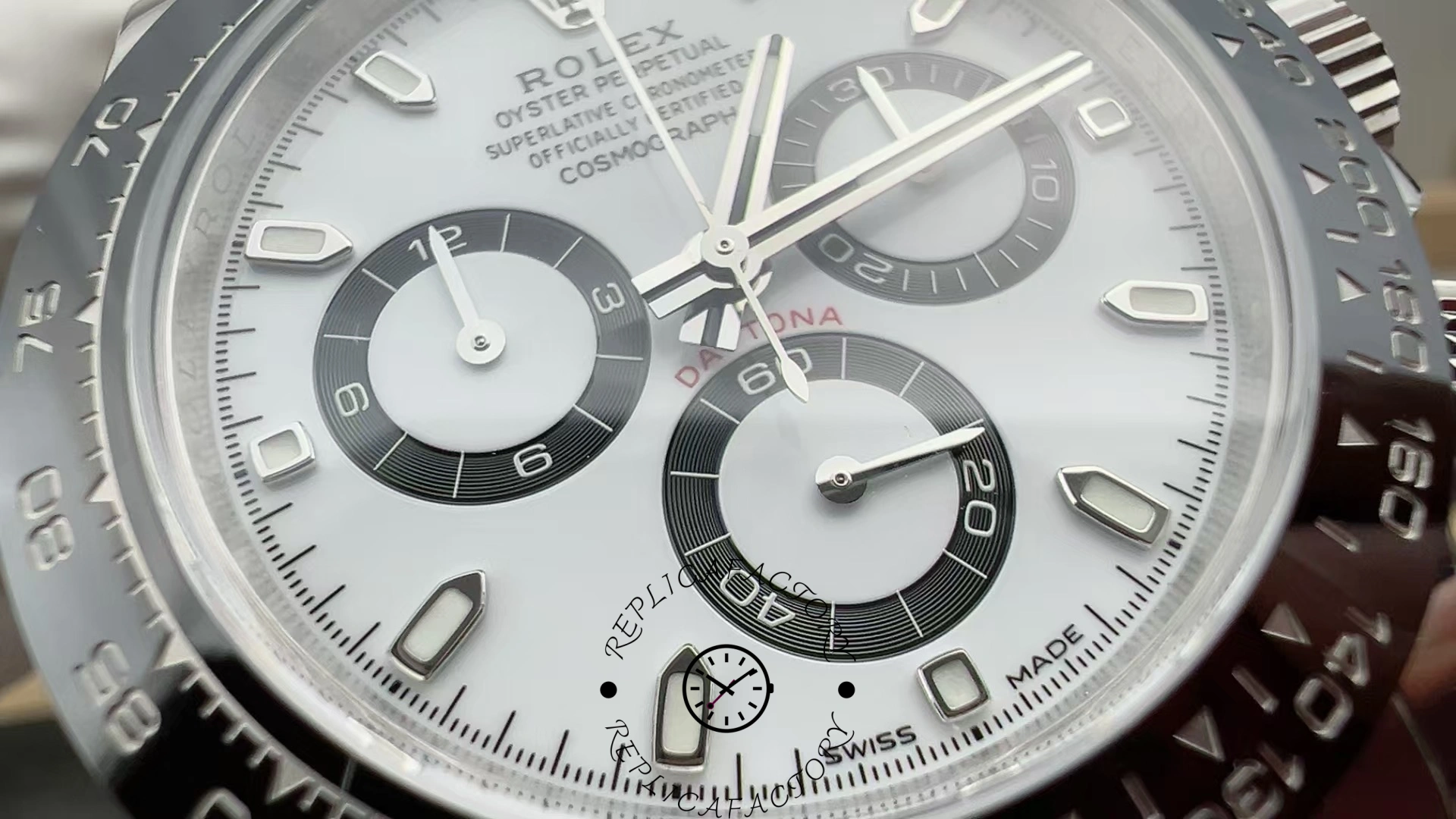 Macro shot of the Rolex Cosmograph Daytona M126500LN-0001 highlighting the subdials and red “Daytona” text.