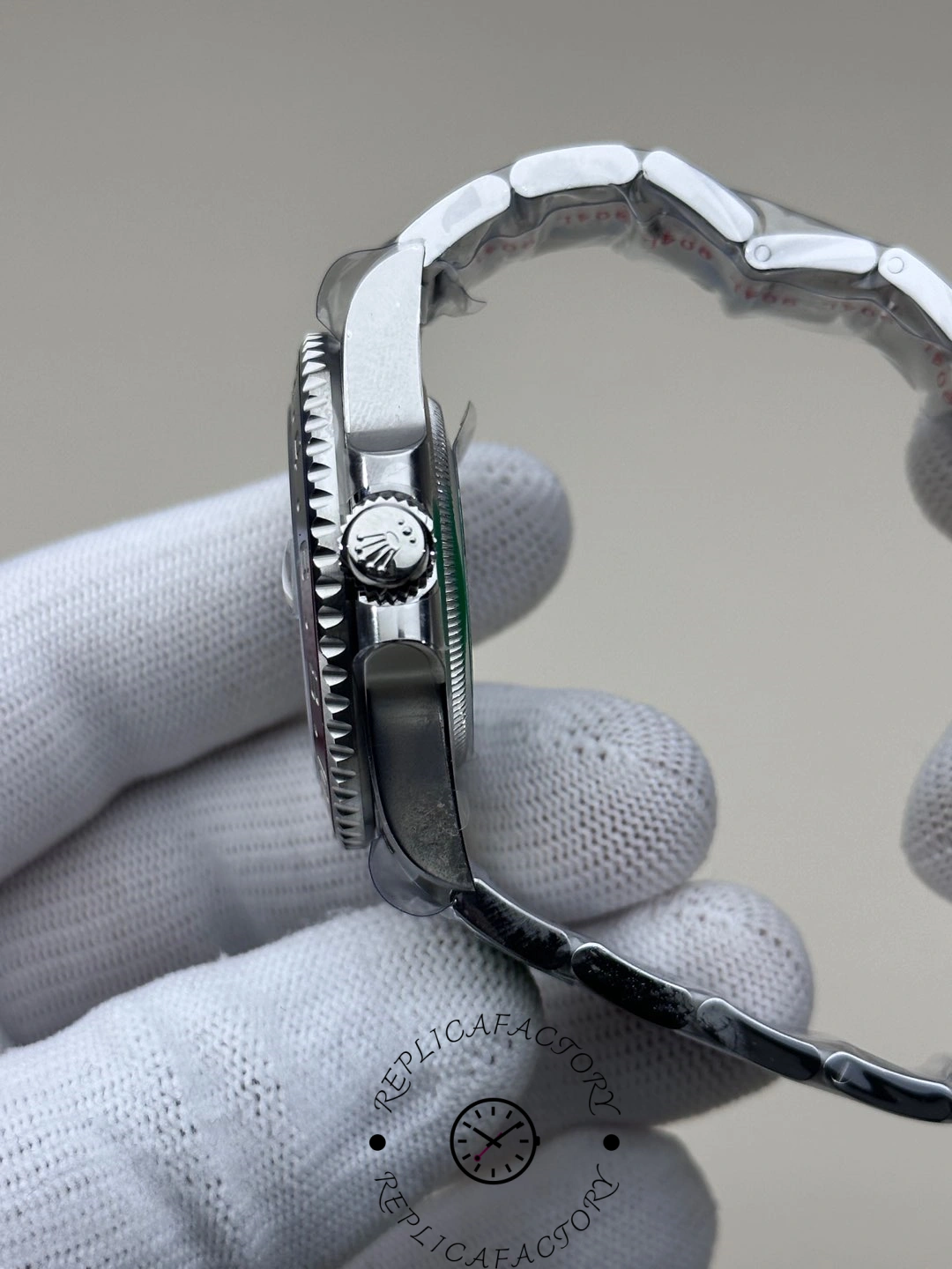 Crown side view of the Rolex GMT-Master II 126719BLRO-0002 showing engraved crown logo and polished case.