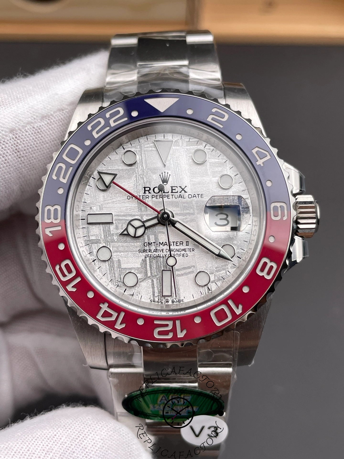 Close-up of the Rolex GMT-Master II 126719BLRO-0002 highlighting the silver meteorite dial and red GMT hand.